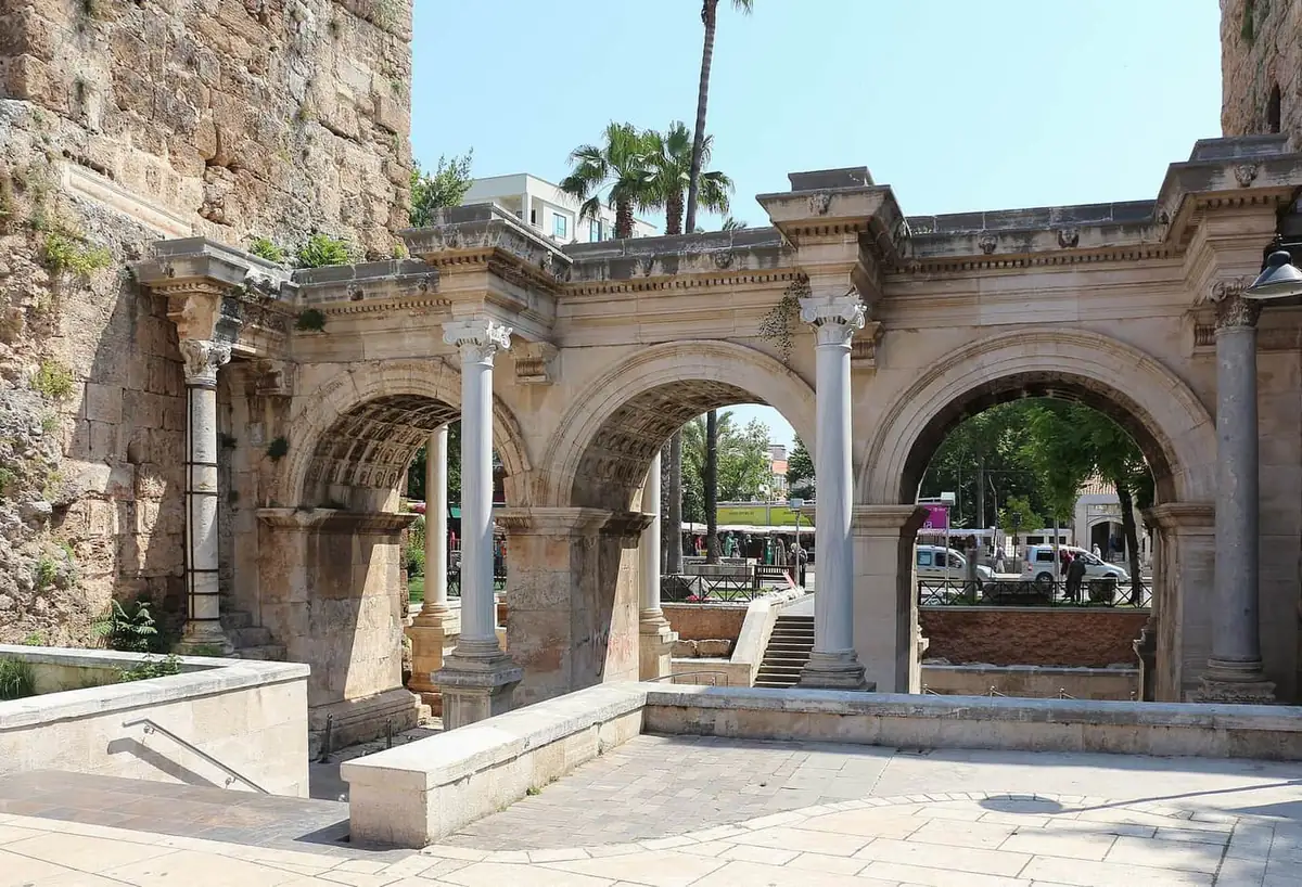 Triple marble arches of Hadrian's Gate set into the old city walls