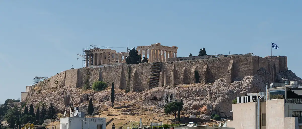 The Acropolis and Parthenon above Athens, with scaffolding from restoration work visible on the left