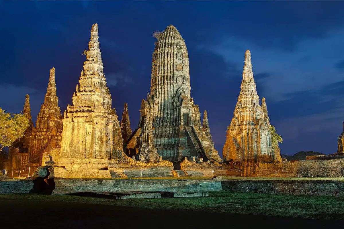 The prangs of Wat Chai Watthanaram in Ayutthaya lit up at night