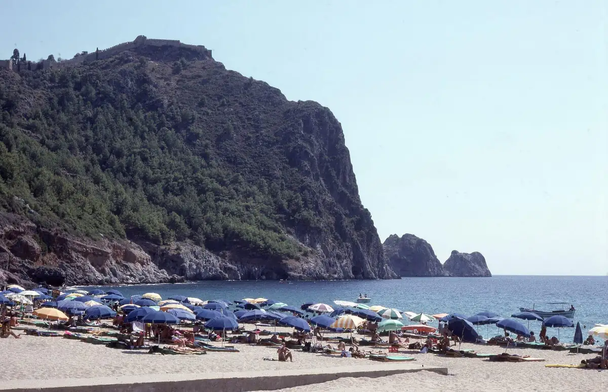 Sun umbrellas on Cleopatra Beach in Alanya below the castle hill