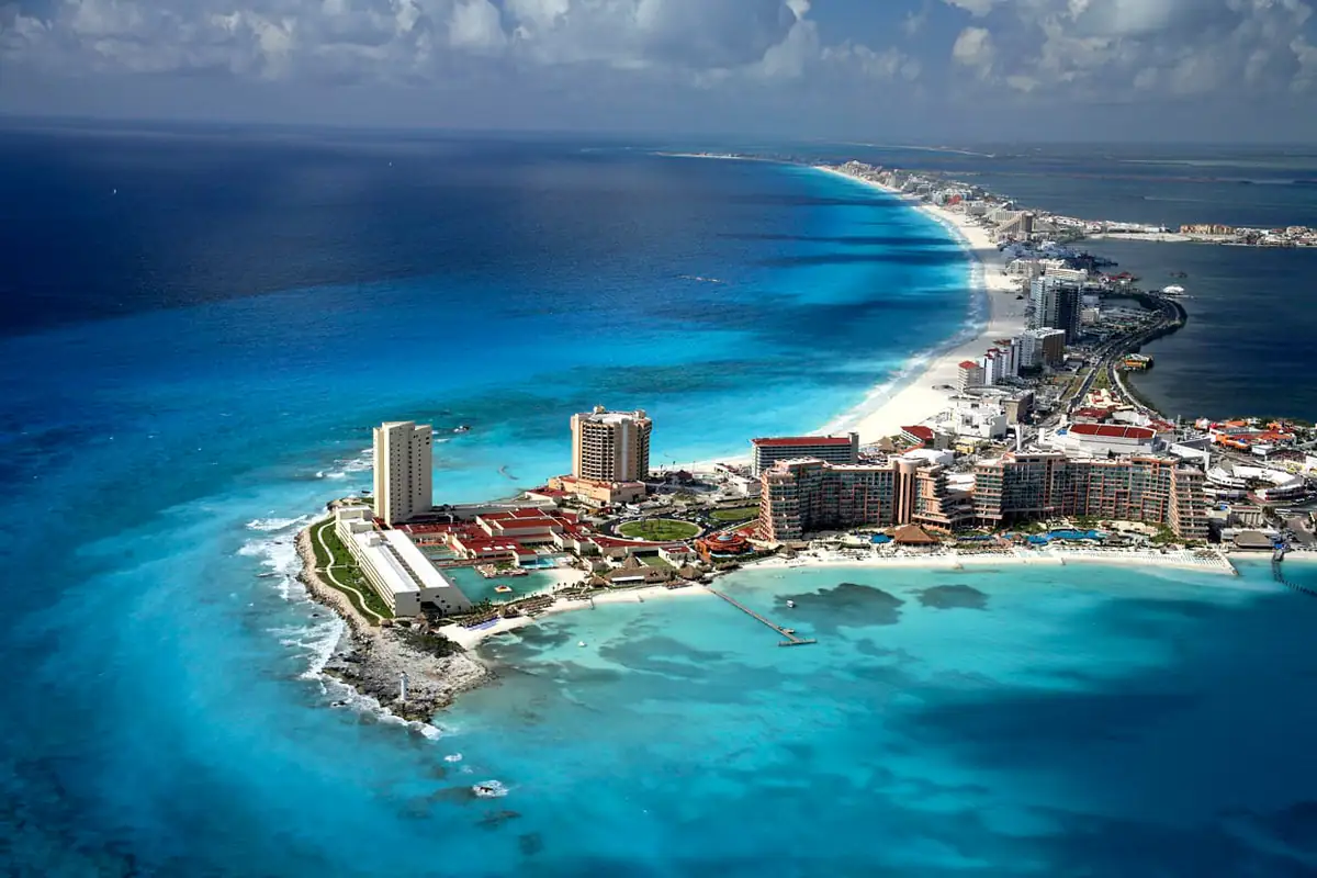 Aerial view of the Cancun Hotel Zone strip between turquoise sea and lagoon