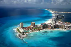 Aerial view of the Cancun Hotel Zone strip between turquoise sea and lagoon