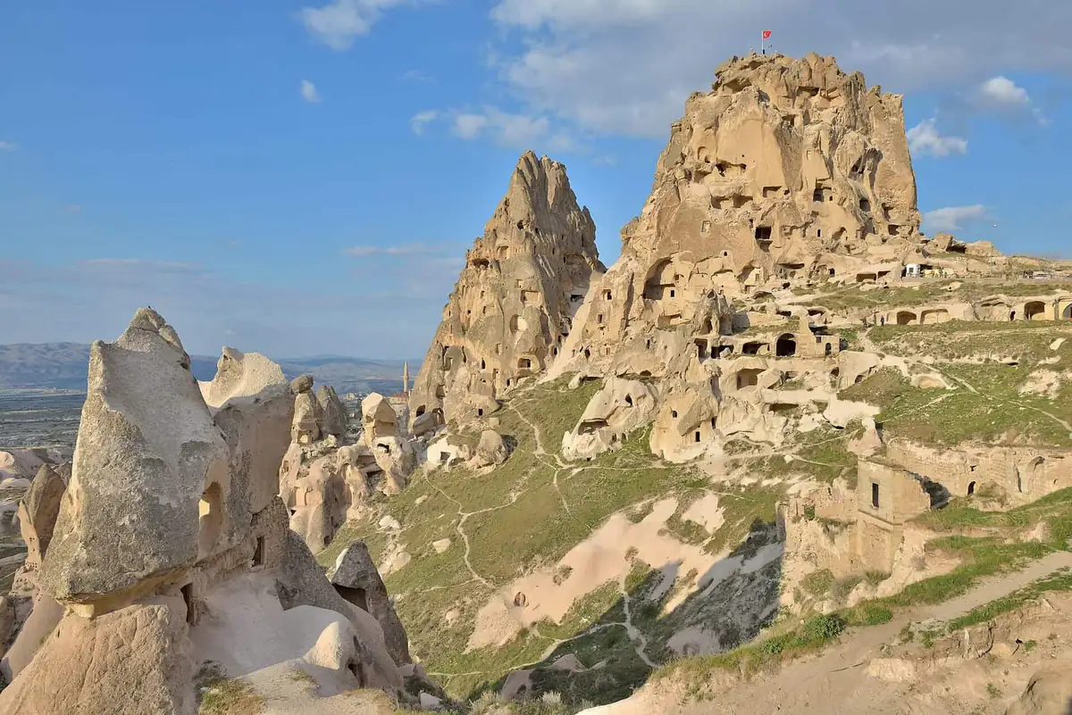 The honeycombed rock castle of Uchisar rising above the valley