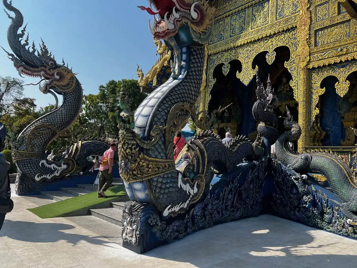 The blue and gold ordination hall of Wat Rong Suea Ten, the Blue Temple, in Chiang Rai