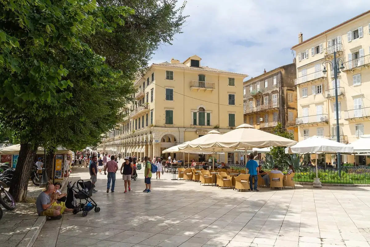 Cafe tables on the Spianada with the Liston arcade behind them in Corfu Town