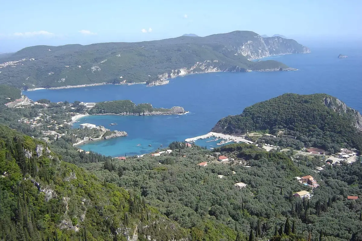 The Paleokastritsa coastline on Corfu, with clear water below green headlands