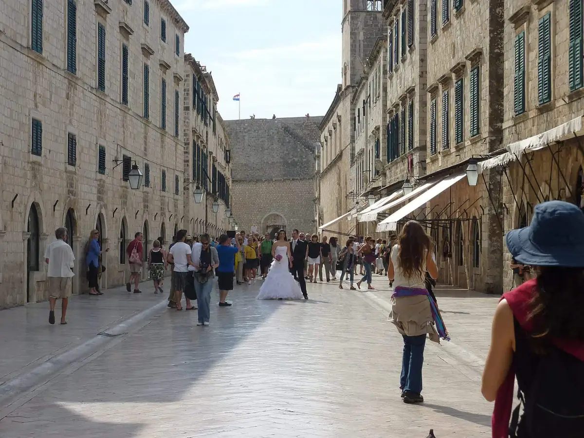 Crowds and a wedding couple on the Stradun in Dubrovnik Old Town