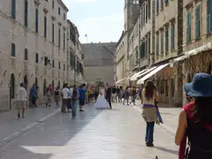 Crowds and a wedding couple on the Stradun in Dubrovnik Old Town