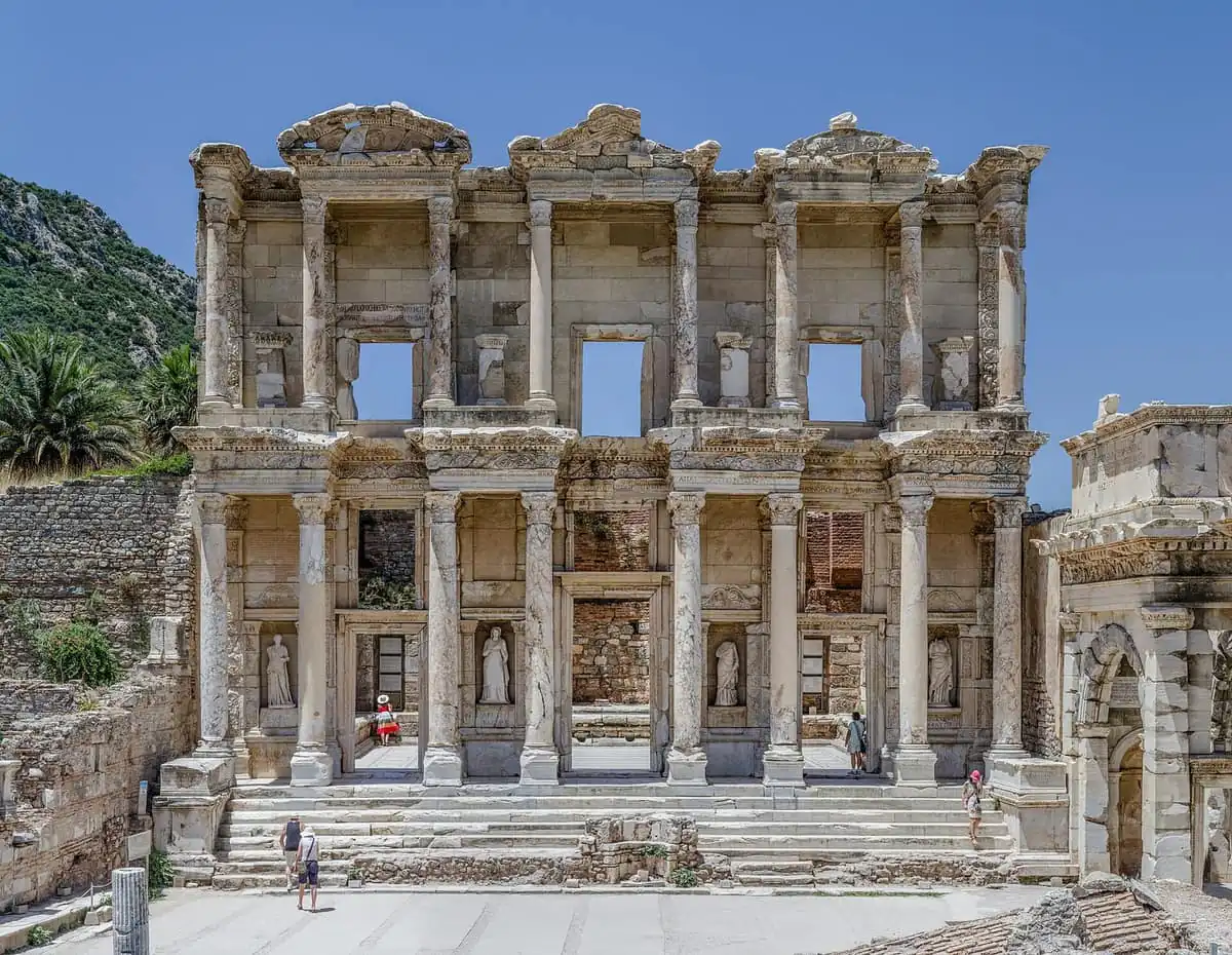 The two-storey marble facade of the Library of Celsus at Ephesus under a clear sky