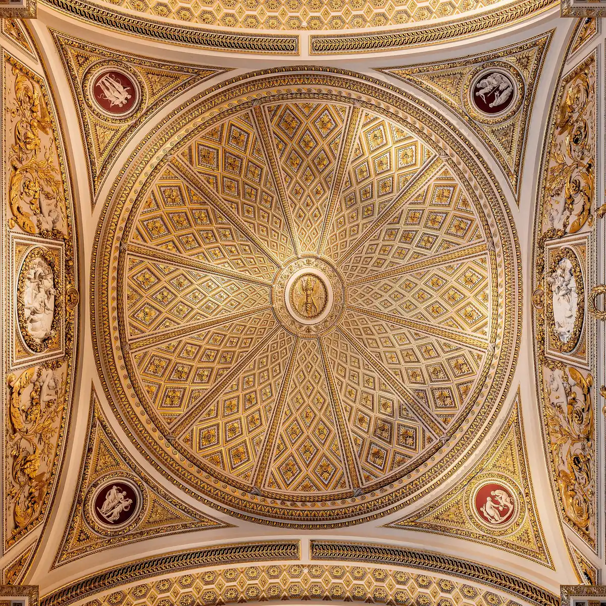 The gilded coffered ceiling inside the Uffizi Gallery in Florence