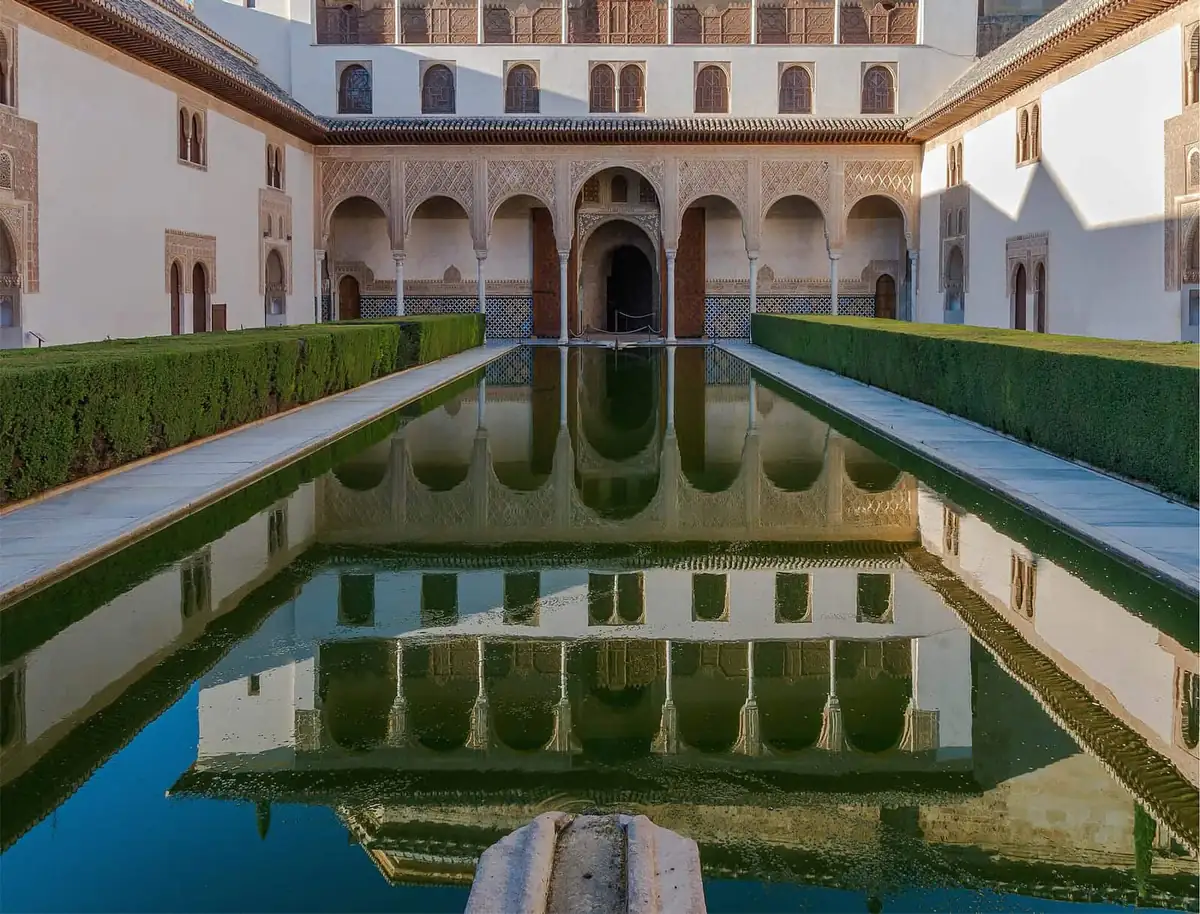 The Patio de los Arrayanes in the Alhambra, its long reflecting pool mirroring the Comares facade