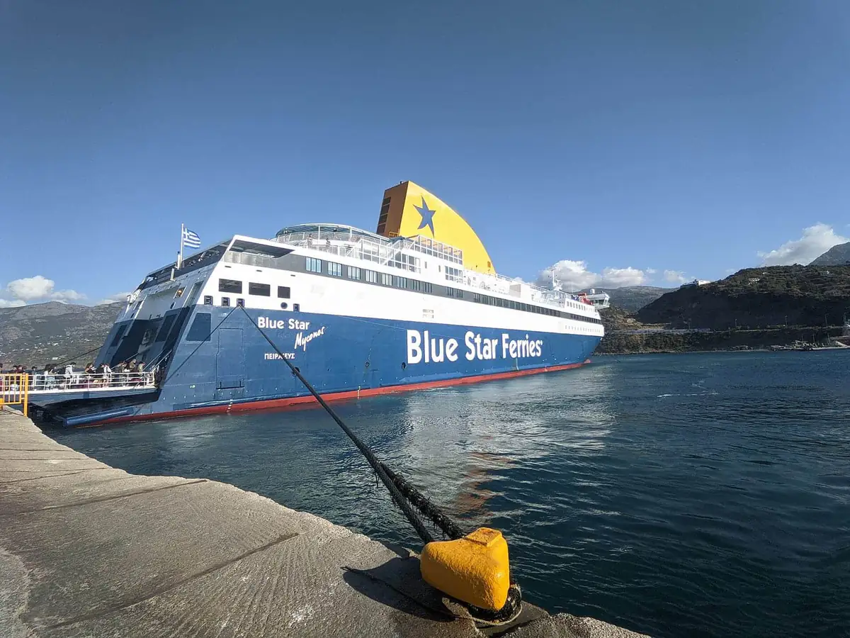 A Blue Star ferry moored at a quiet island port in Greece
