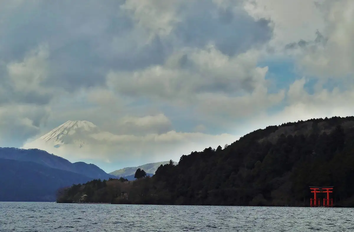 Mount Fuji above Lake Ashi with the red torii of Hakone Shrine