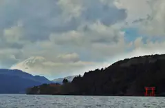 Mount Fuji above Lake Ashi with the red torii of Hakone Shrine