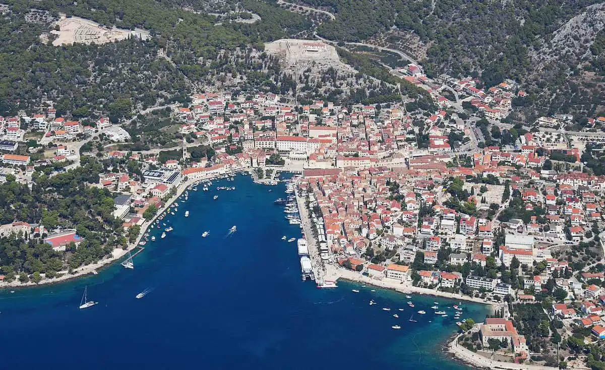 Aerial view of Hvar Town harbour with the fortress hill behind