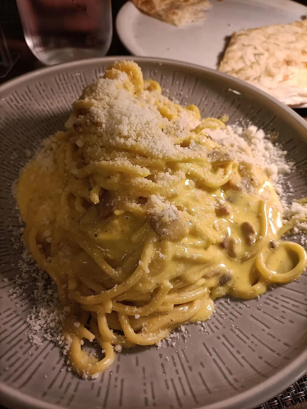 Spaghetti alla carbonara with a creamy egg sauce and grated pecorino in Rome