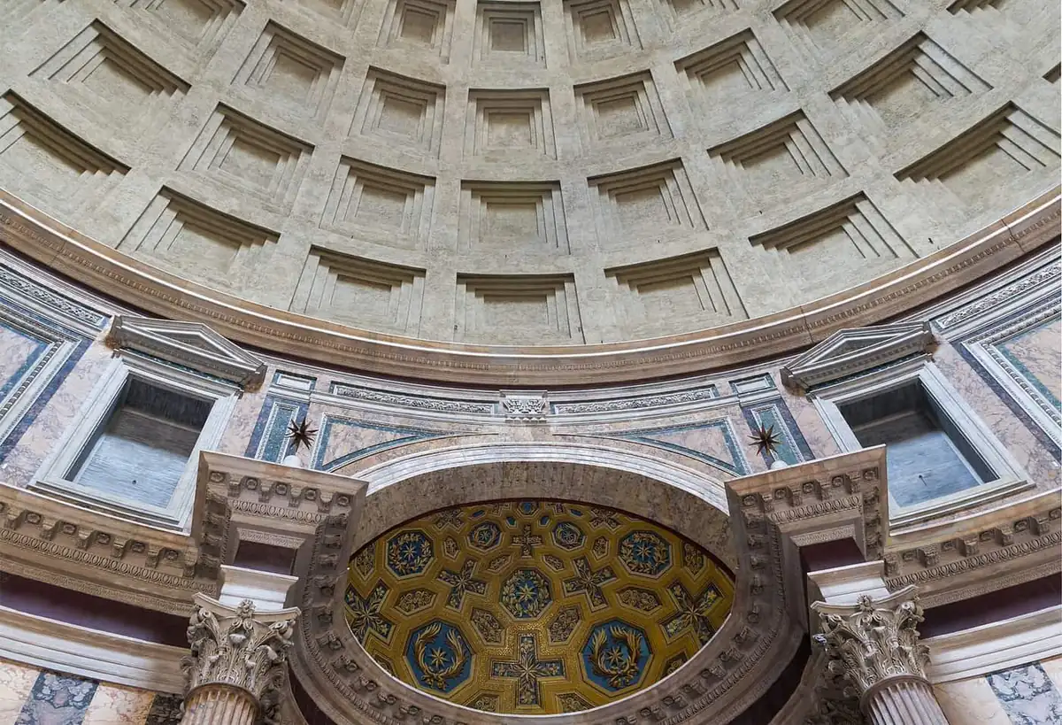 The coffered concrete dome and decorated apse inside the Pantheon in Rome