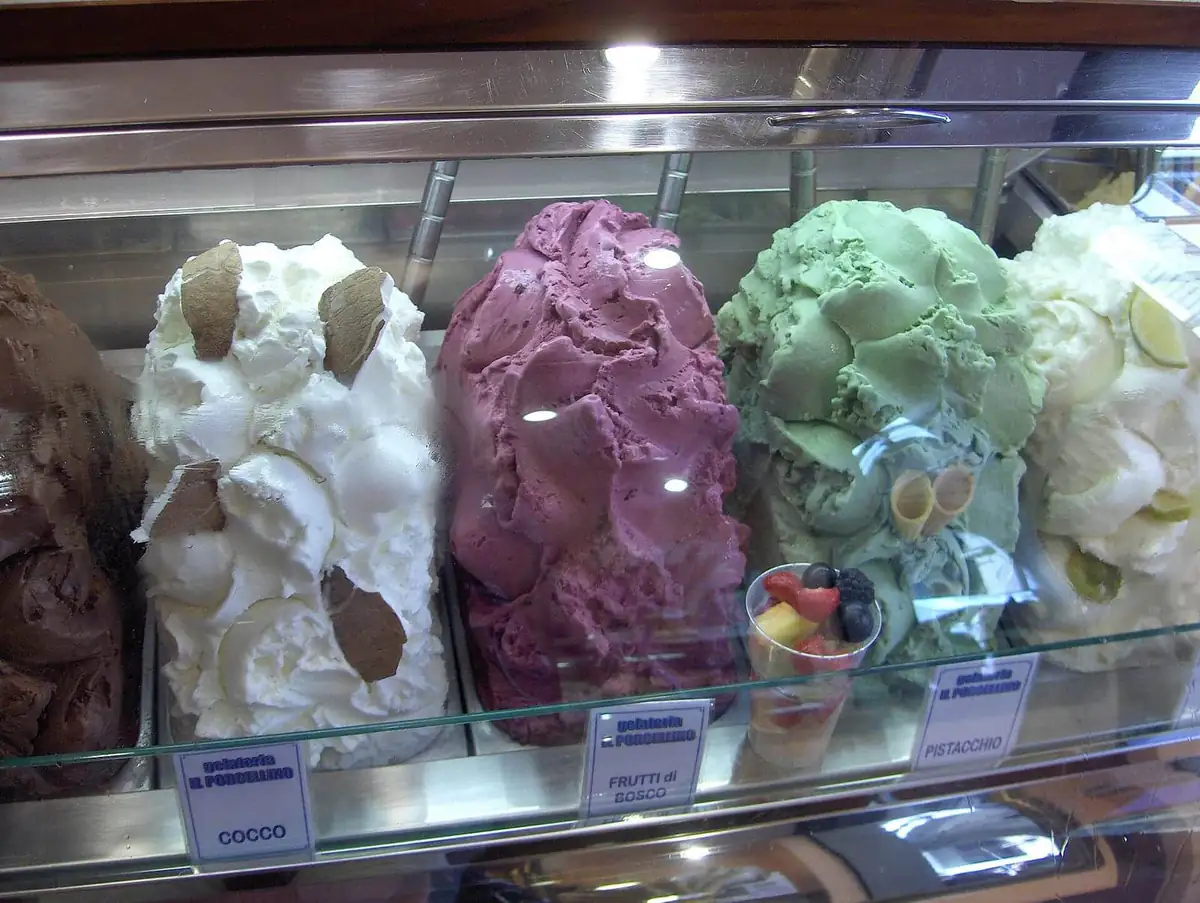 Mounded gelato flavours in a display case at a gelateria in Florence