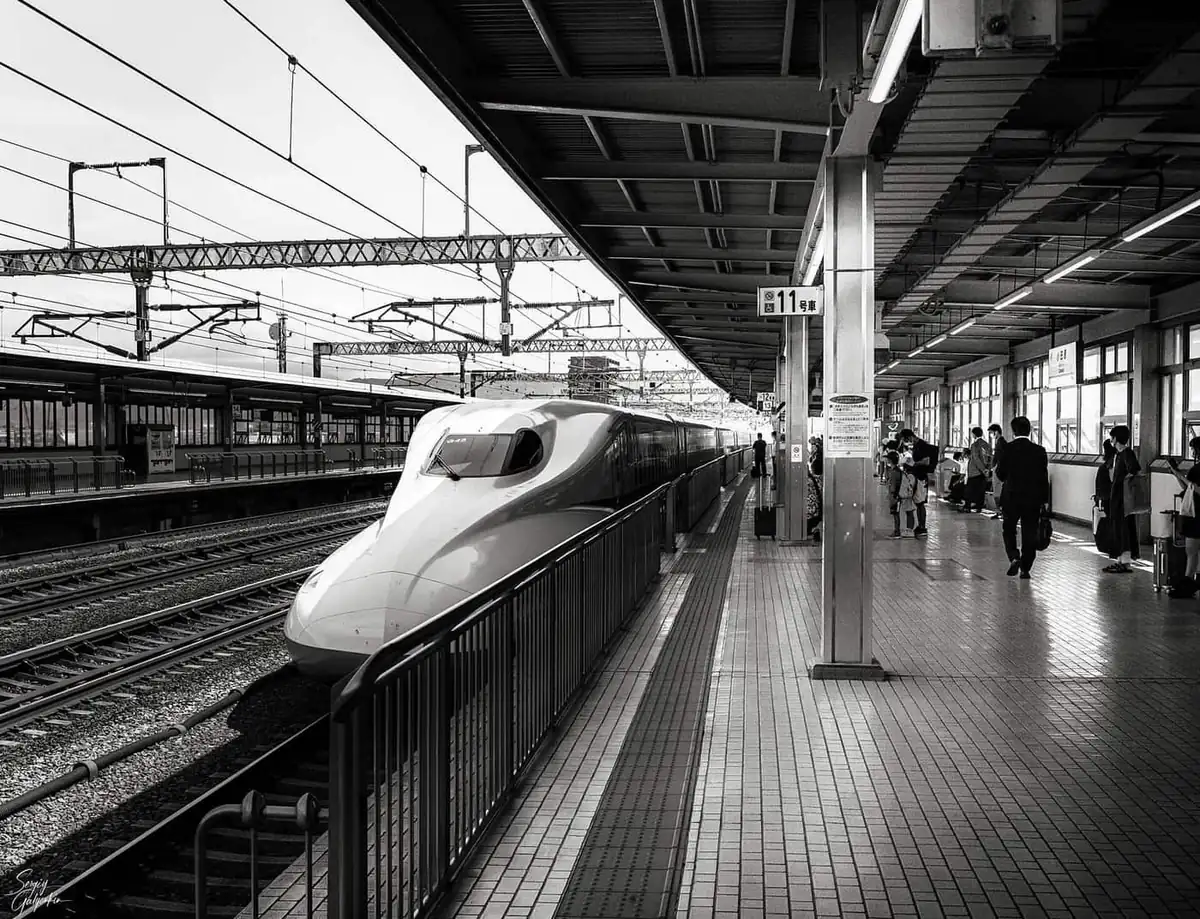 A Shinkansen bullet train at a station platform