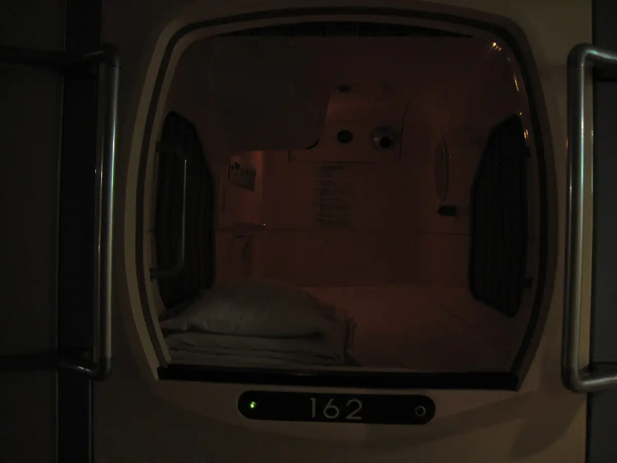 A capsule hotel pod in Osaka, numbered 162