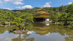 Kinkaku-ji, the Golden Pavilion in Kyoto, reflected in its pond on a clear day