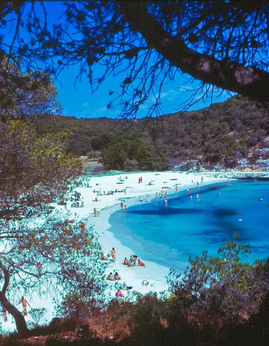 Swimmers and sunbathers on the white sand at Cala Mondrago near Porto Petro