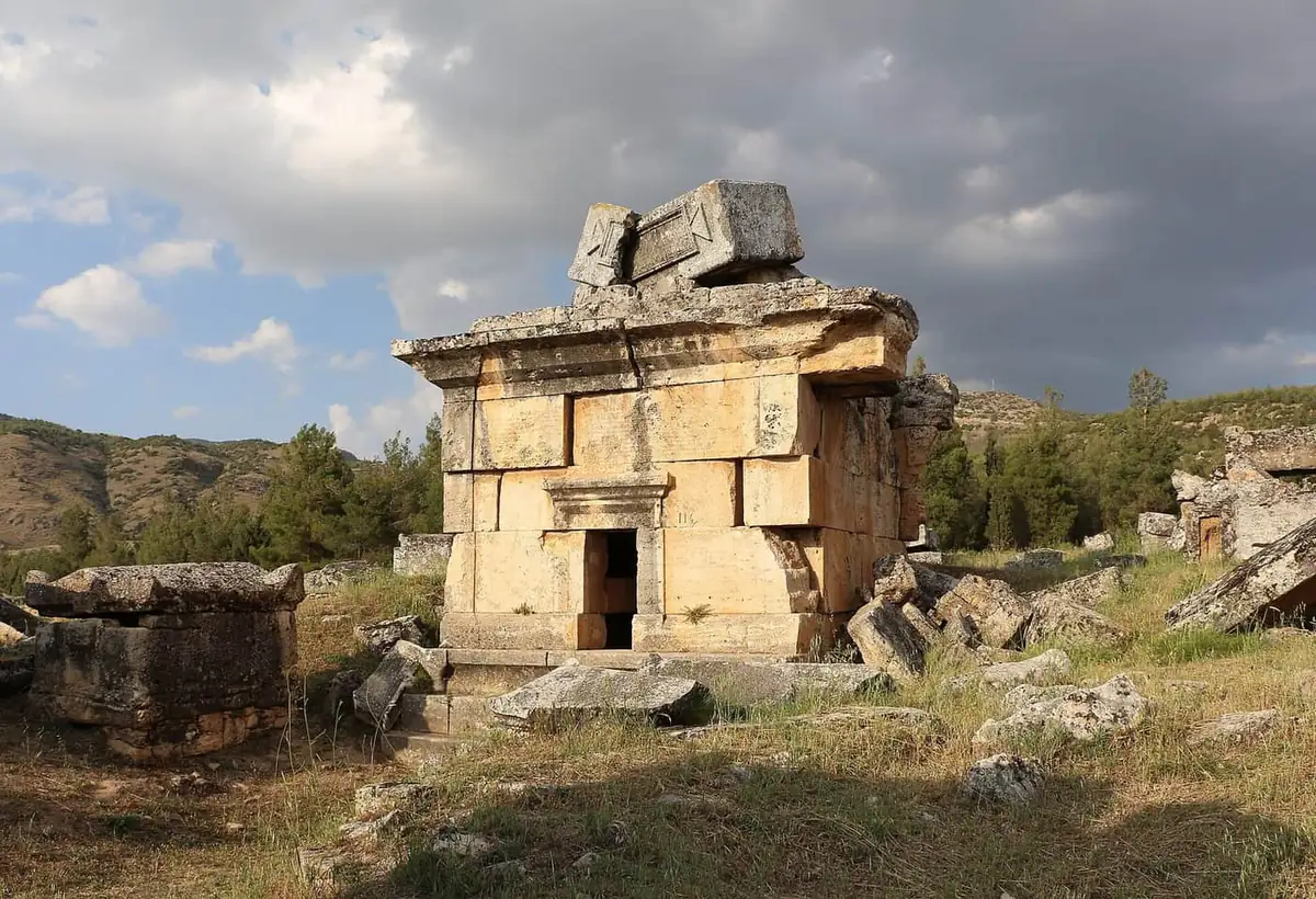 The necropolis at Hierapolis, with carved Lydian-style tombs standing among scrub and cypress trees