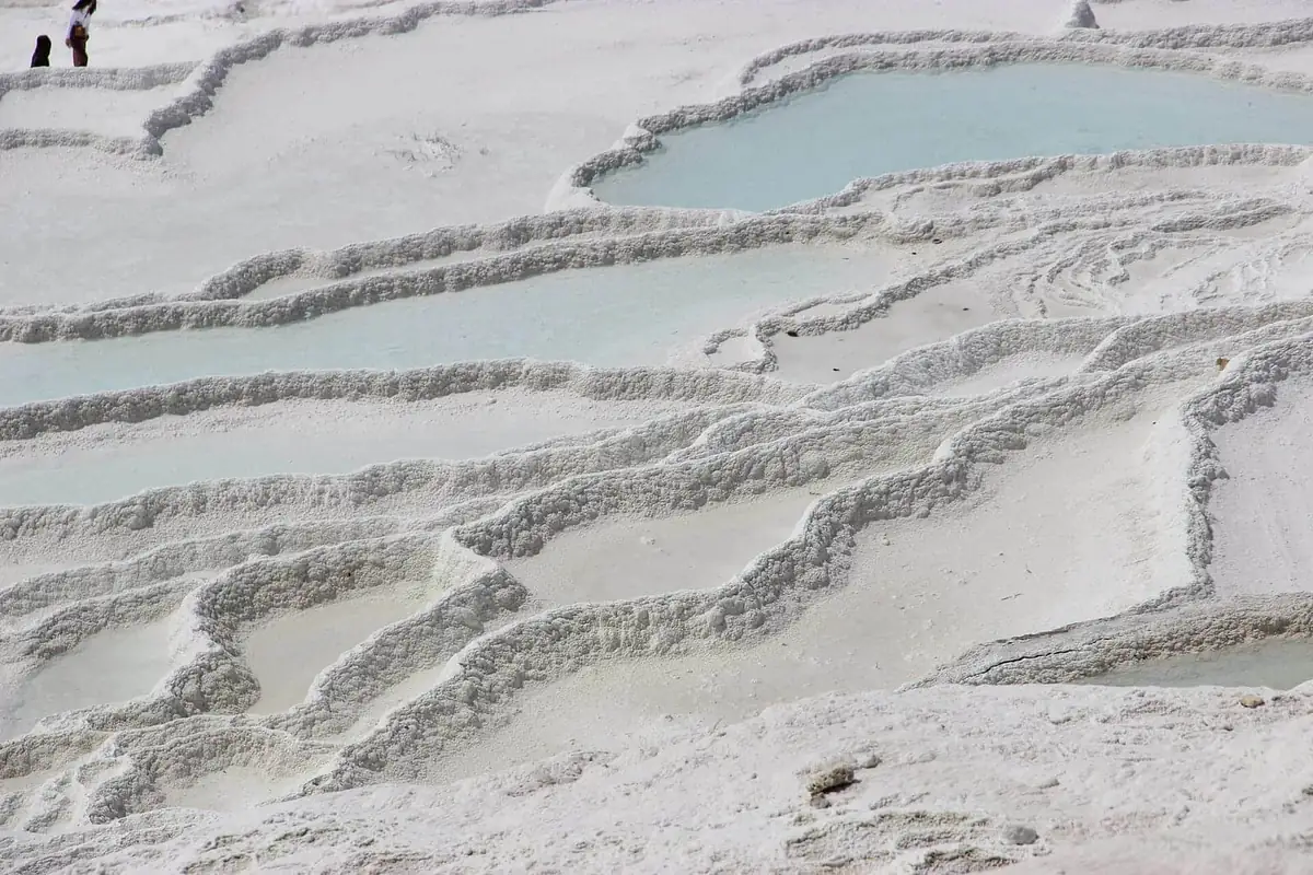 Shallow turquoise pools along the rim of the Pamukkale travertines in the off season