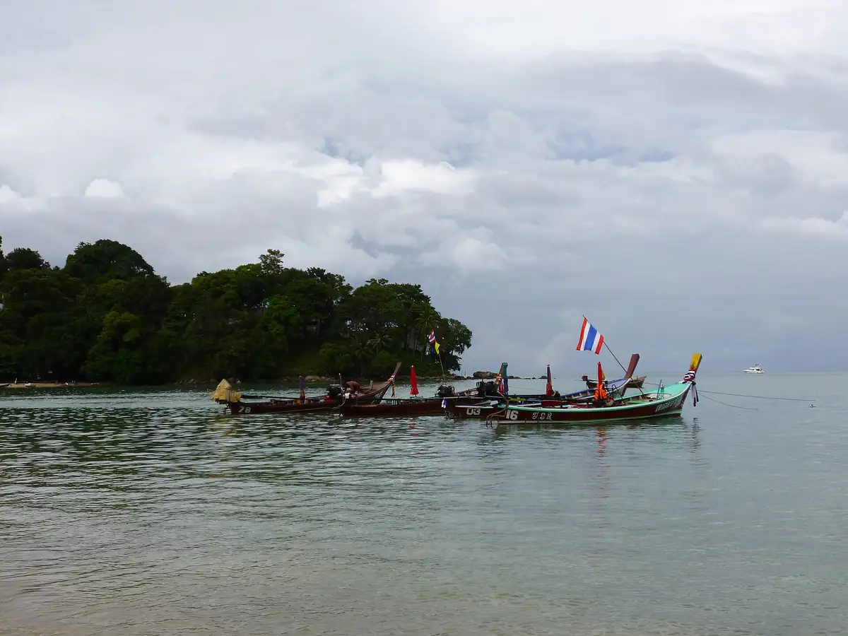 Longtail boats anchored off a Phuket beach