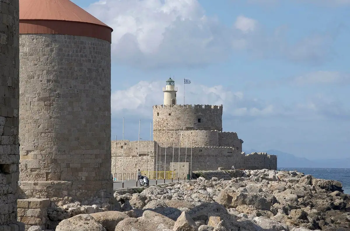 The windmills and Fort Saint Nicholas at the entrance to Mandraki harbour in Rhodes Town