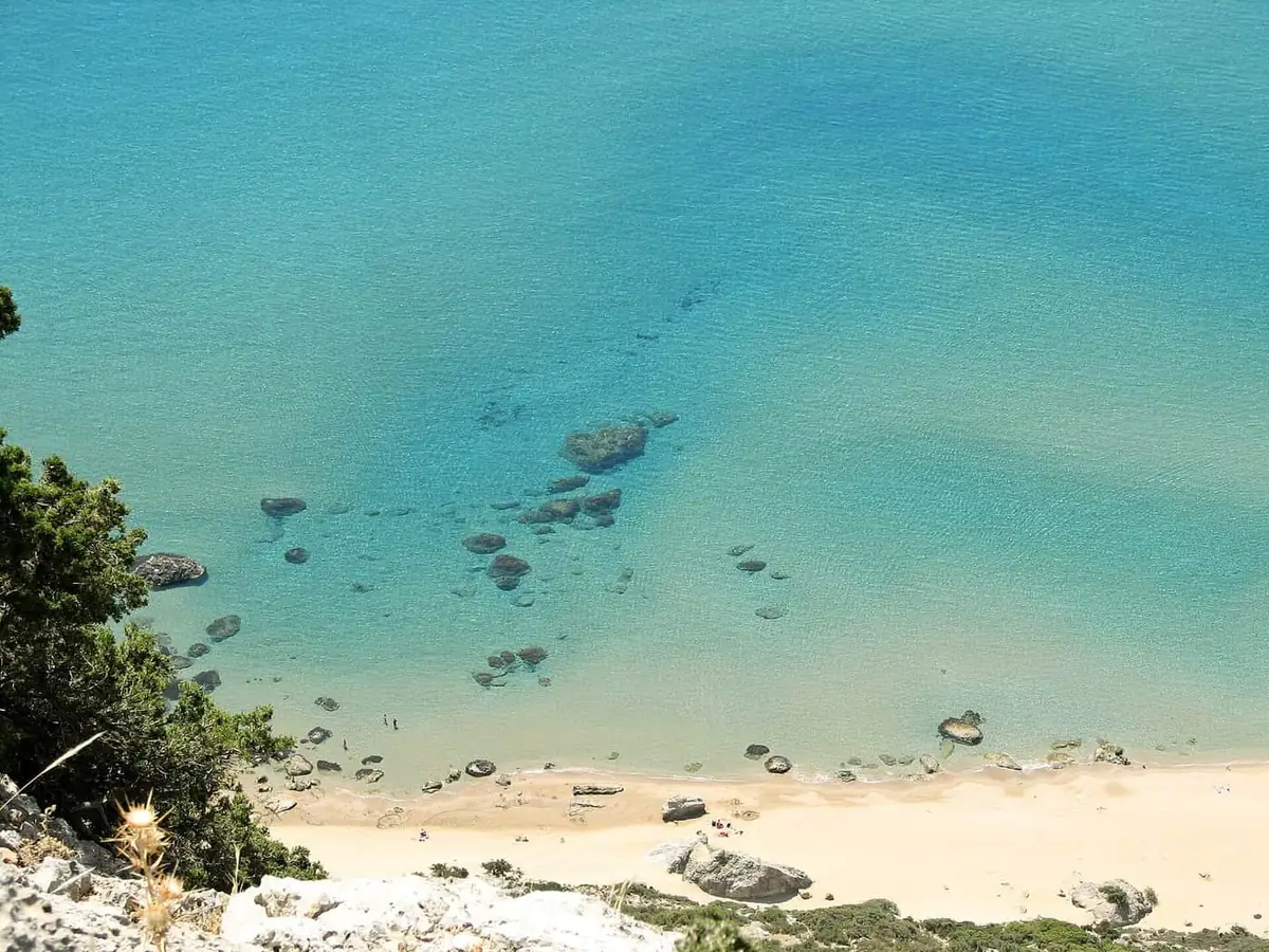 Turquoise water and sand at Tsambika bay on Rhodes, seen from the monastery ridge