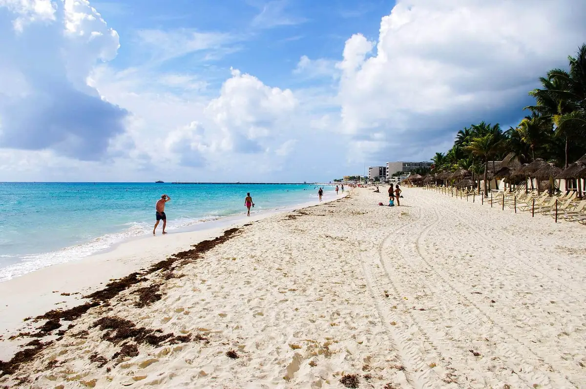 White sand and palapas on Mamitas beach in Playa del Carmen