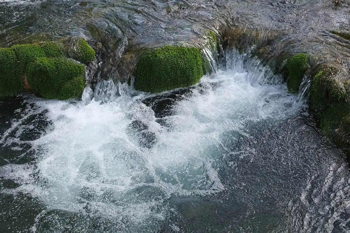 Water threads over mossy travertine at Krka National Park