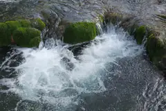 Water threads over mossy travertine at Krka National Park