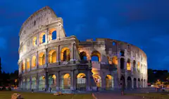 The Colosseum in Rome lit up at dusk
