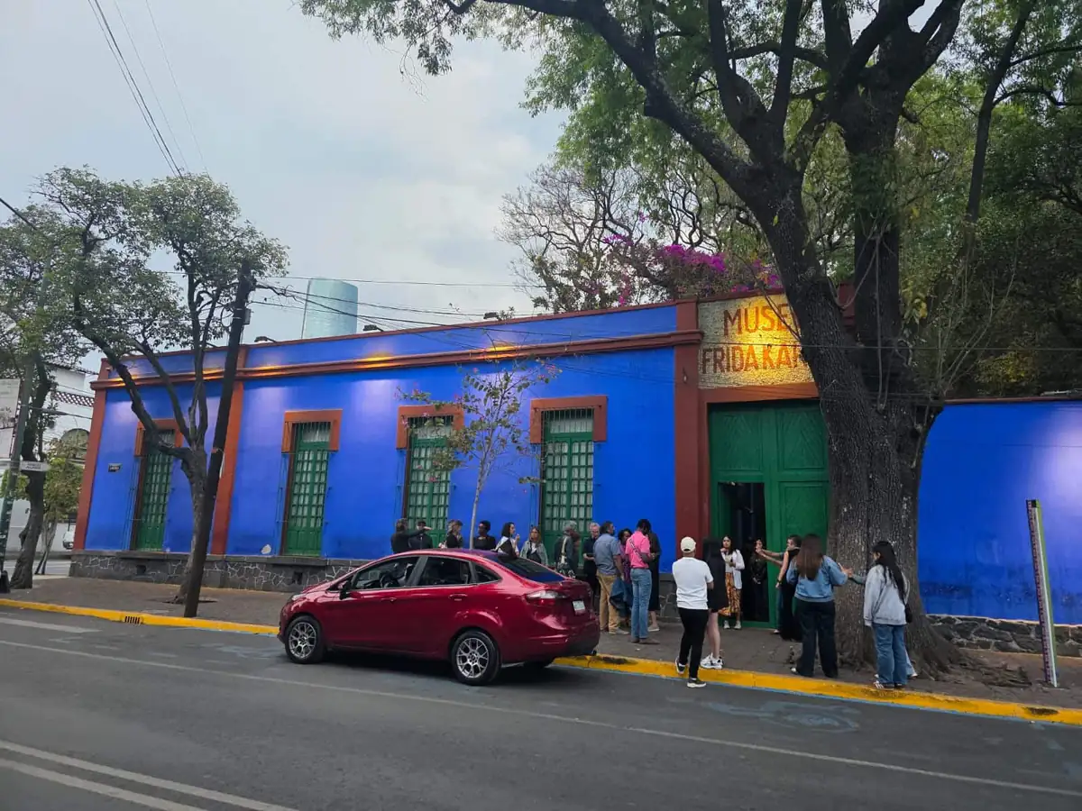 Visitors queue outside the blue Casa Azul in Coyoacan