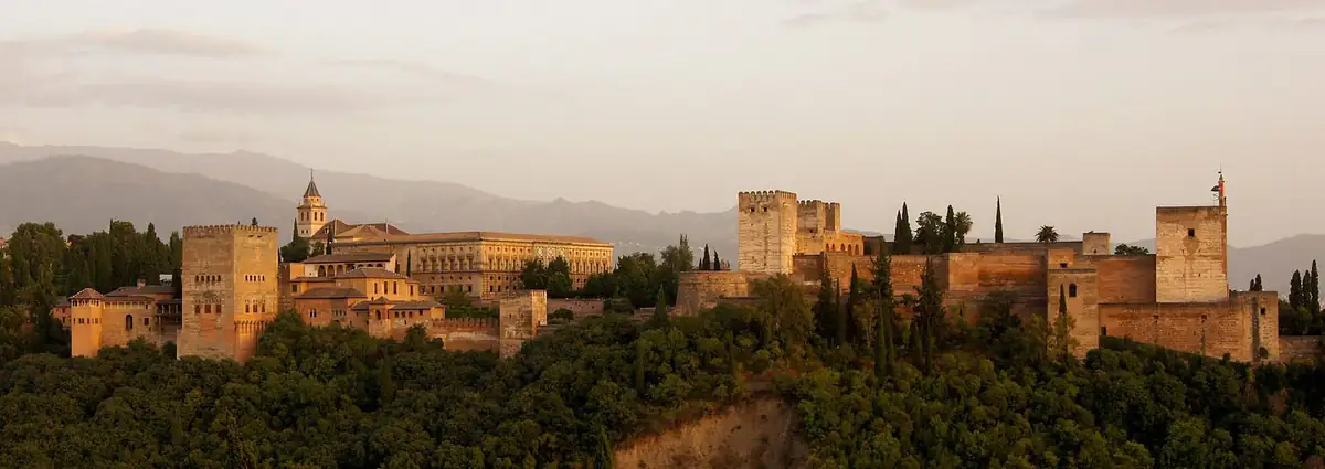 The Alhambra palace above Granada in evening light