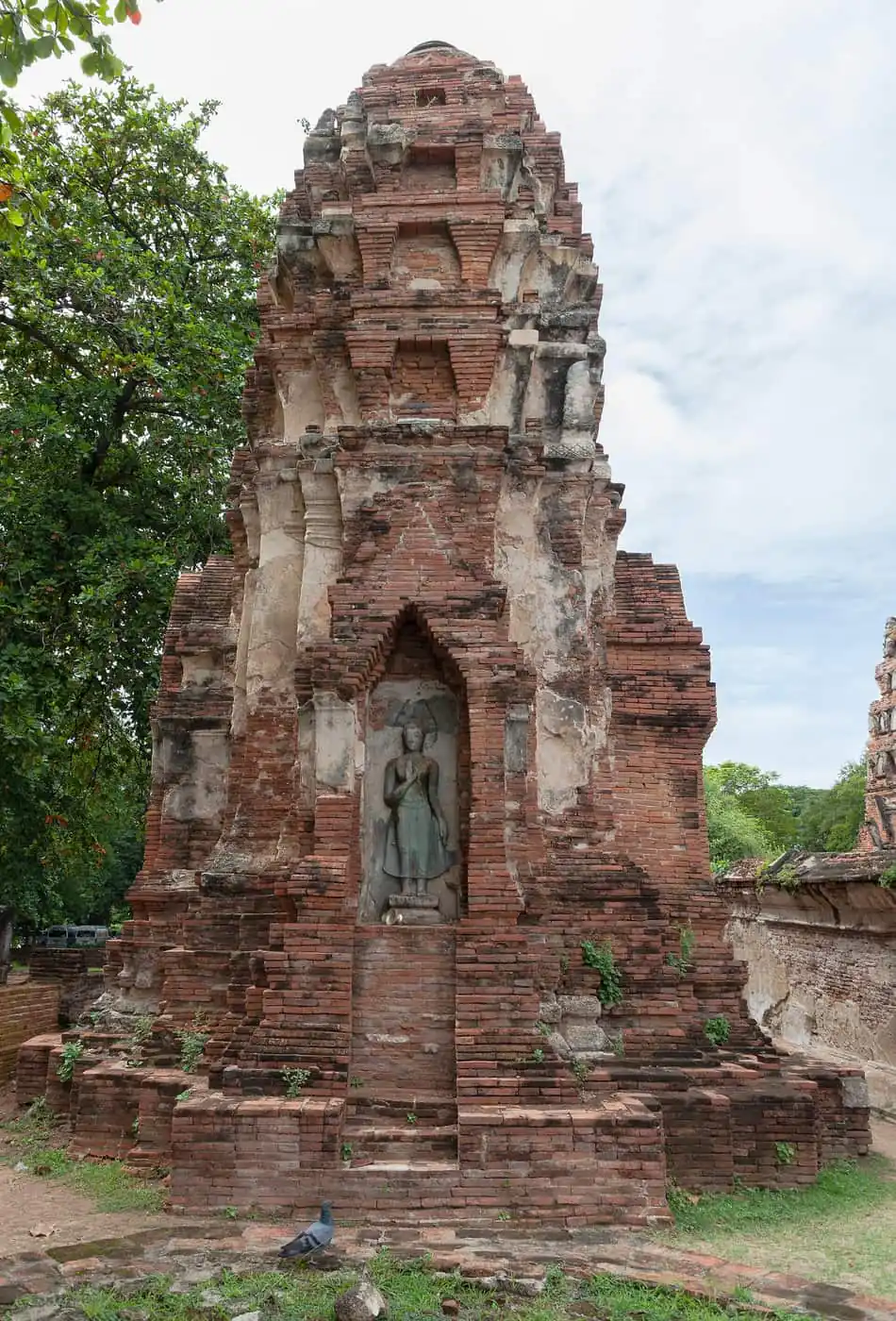 Brick prang with a standing Buddha niche at Wat Mahathat in Ayutthaya