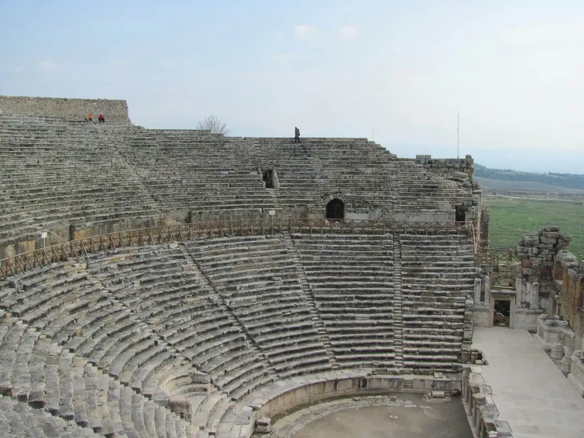 The sweeping stone cavea of the theatre at Hierapolis above Pamukkale