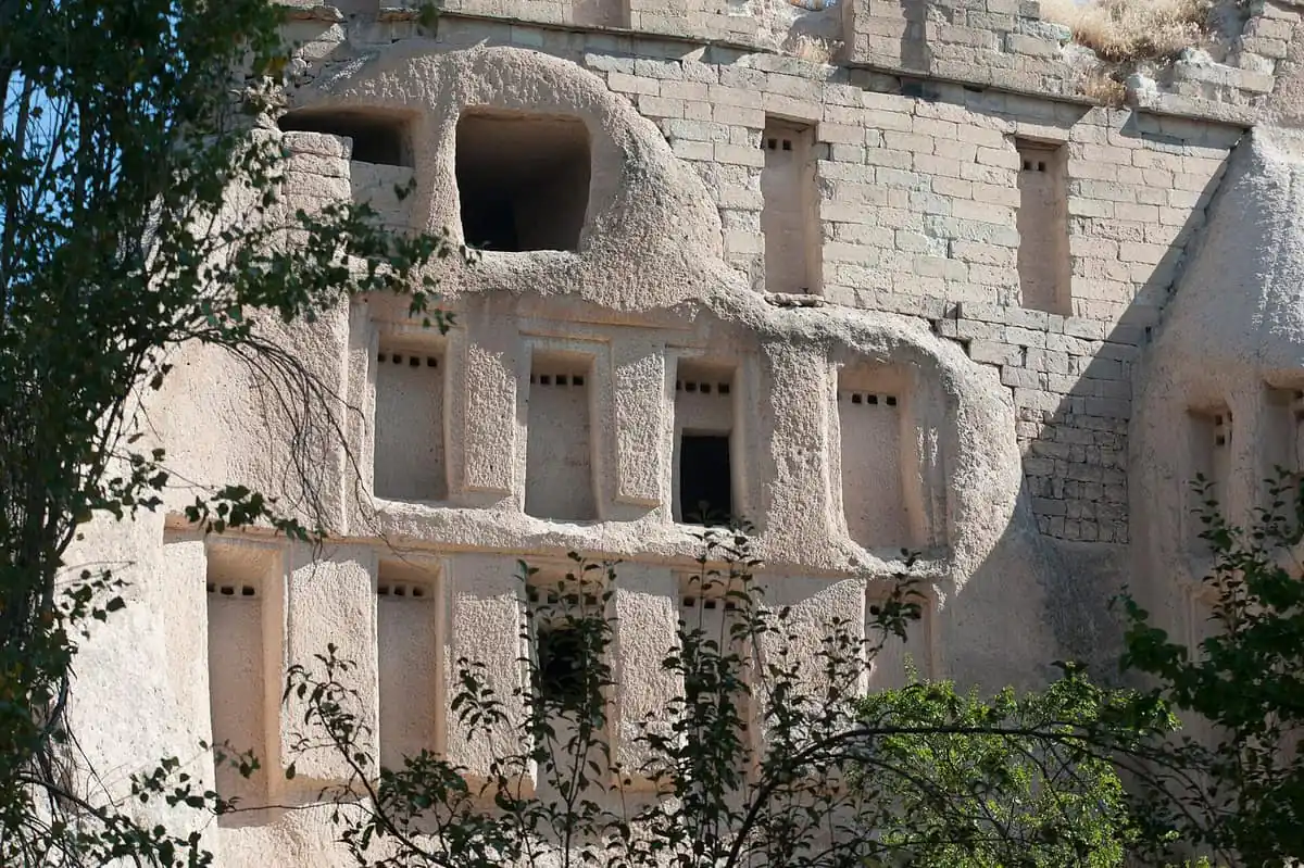 Carved dovecotes honeycombing the cliffs of Pigeon Valley near Uchisar