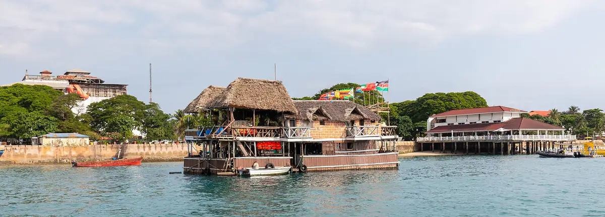 Boats and a floating restaurant on the Stone Town seafront, Zanzibar