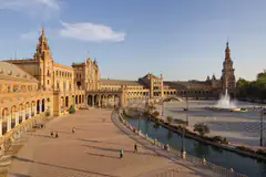 The Plaza de España in Seville with its canal, bridge and fountain in late afternoon light