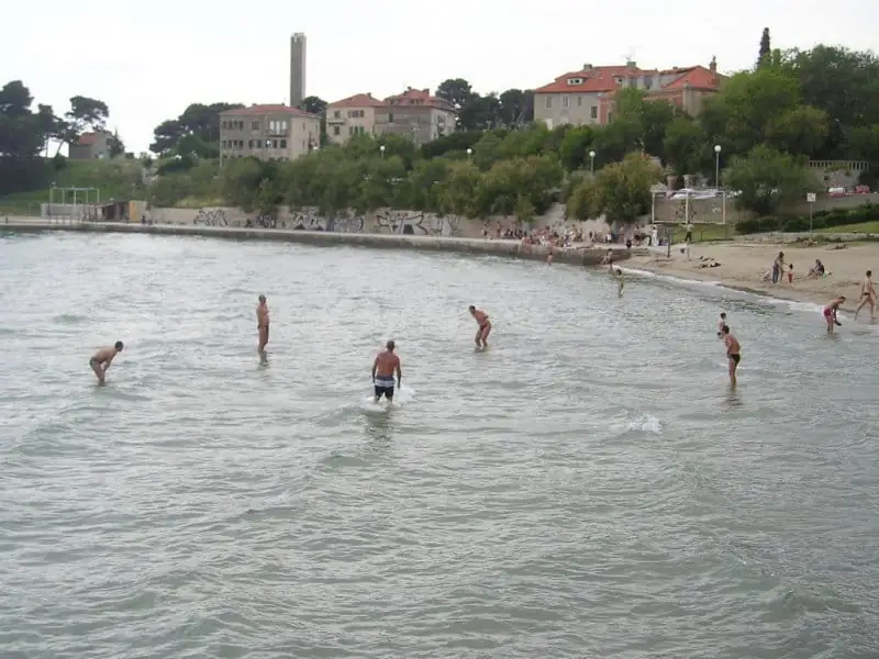 Players mid-game in the shallows at Bacvice