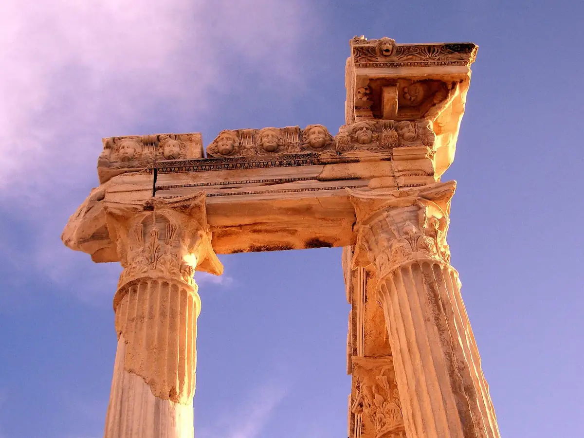 Sunlit columns of the Temple of Apollo at Side against a blue sky