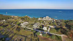 Aerial view of the clifftop Tulum Mayan ruins above the turquoise Caribbean Sea