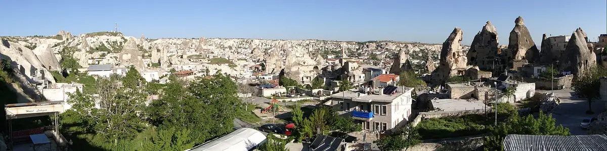 Panorama over Goreme's fairy chimneys and cave hotels from a hotel terrace