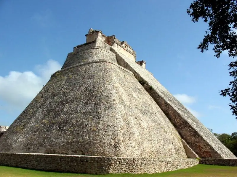 The Pyramid of the Magician rising over the lawn at Uxmal