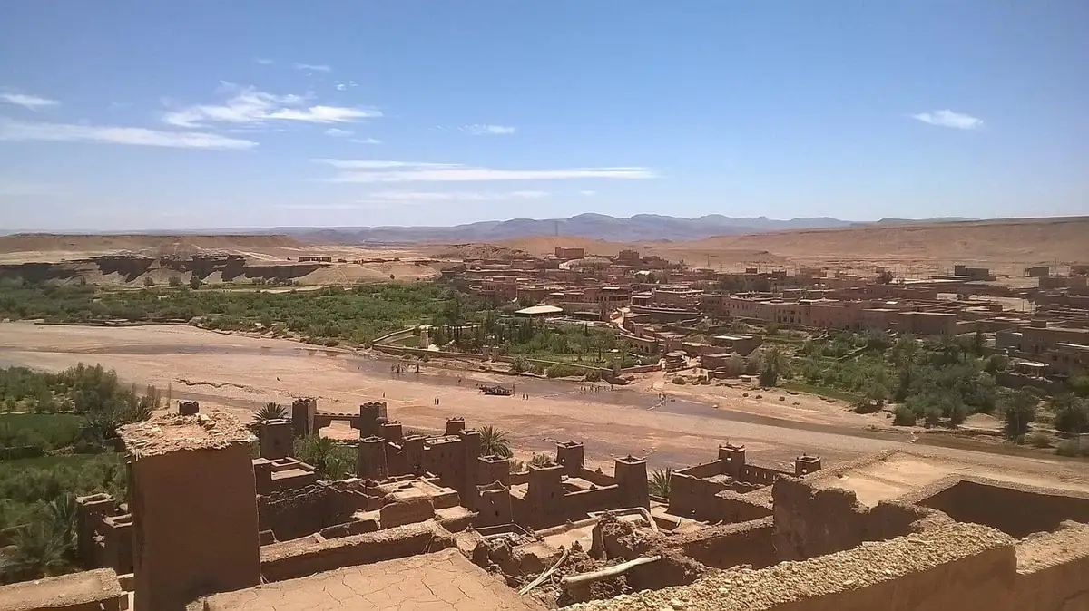 The mud-brick kasbah of Ait Ben Haddou above the river valley and palm groves