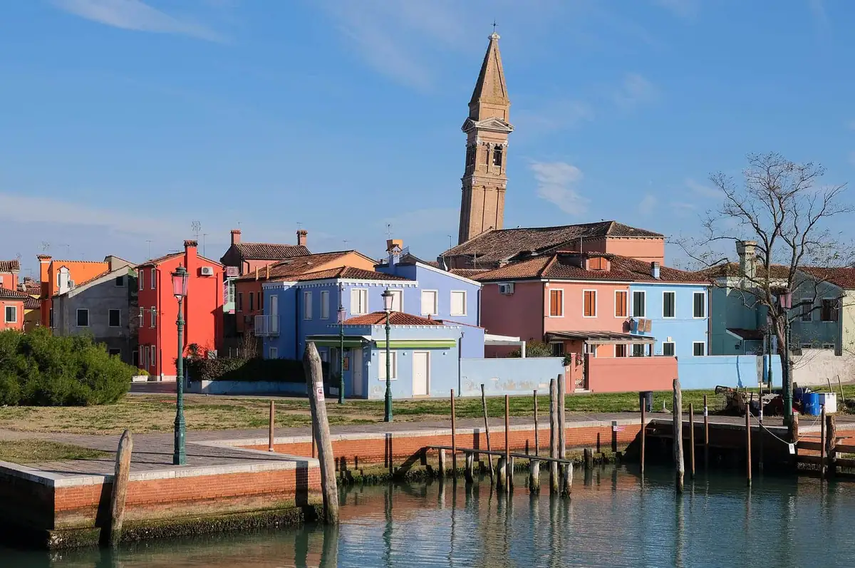 Colourful houses and the leaning bell tower on Burano island near Venice