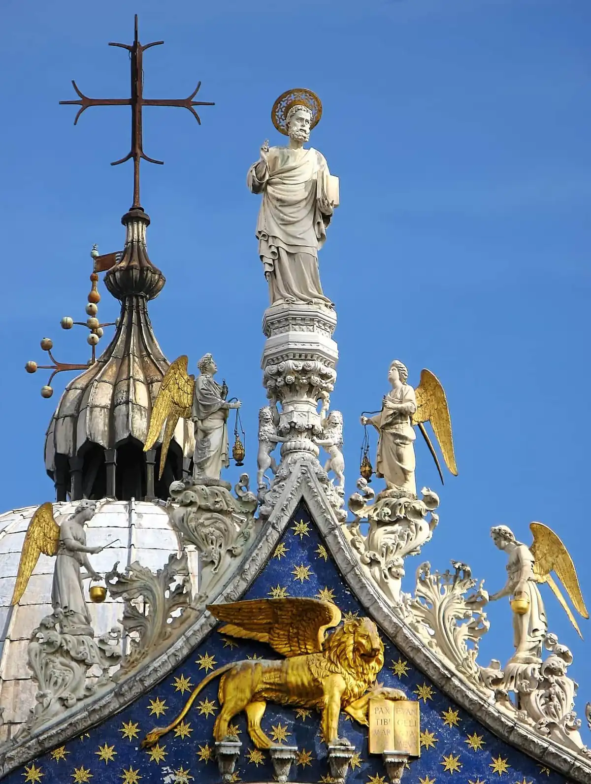 Statues and the golden winged lion on the roof of St Mark's Basilica in Venice
